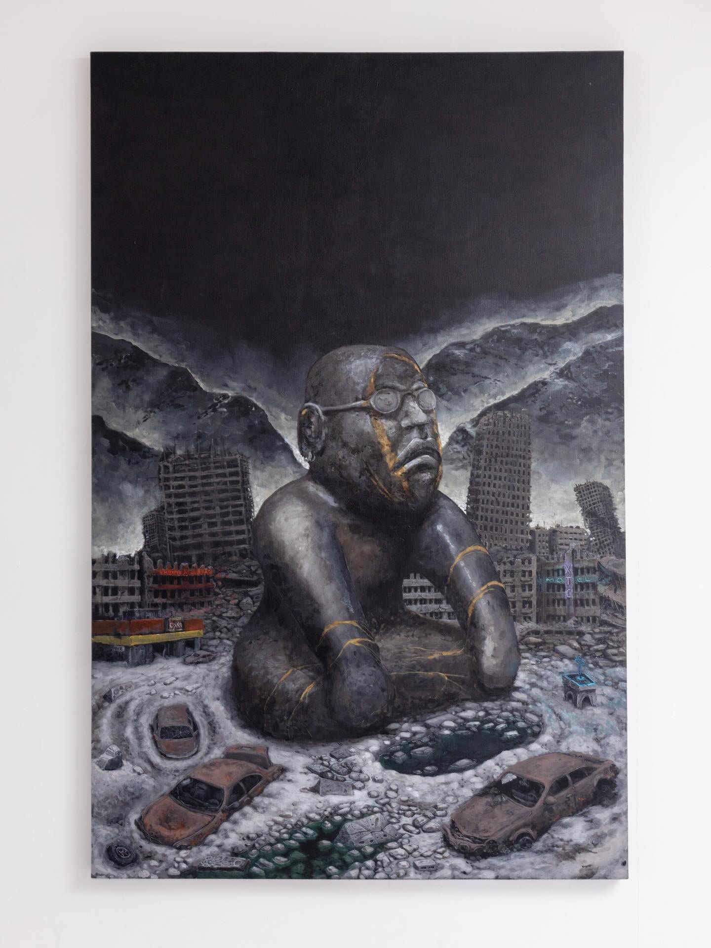 Painting of a monumental stone head seated among the ruins of a destroyed city, by Alejandro Núñez Ferrara